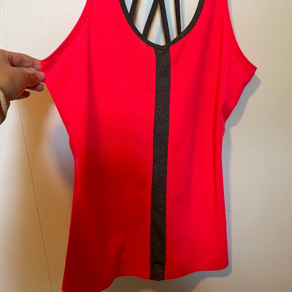 Bright pink tank with criss cross design in back!